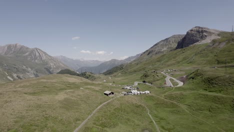 reverse-and-bird's-eye-view-plane-with-drone-video-flying-lake-Verne-and-col-du-petit-saint-Bernard-and-valley-Aosta