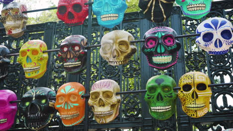 Colorful-calavera-sugar-skulls-displayed-outside-the-gates-of-Bosque-de-Chapultepec-for-Day-of-the-Dead-in-Mexico-City