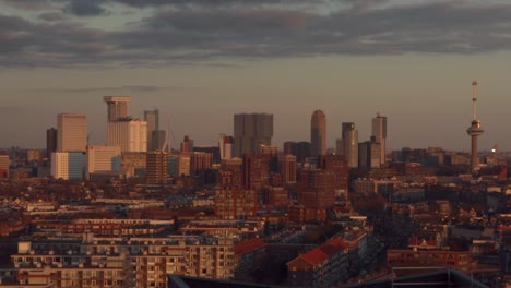 Close-up-shot-of-skyline-of-Rotterdam,-the-Netherlands-at-sunset-on-a-sunny-winter-day
