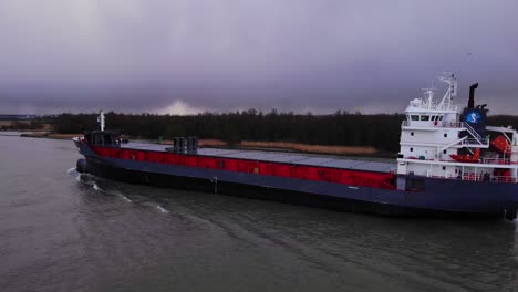 Aerial-View-Of-Ameland-Cargo-Ship-Along-Oude-Maas-On-Gloomy-Cloudy-Day-In-Zwijndrecht