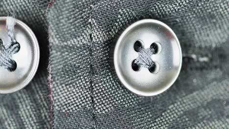Silver-Metallic-Buttons-Fasten-In-A-Damask-Fabric