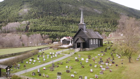 View-On-The-Old-Church-Of-Sel-With-Graves-In-Norway---aerial-drone-shot