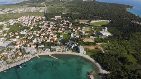 Beach-Main-With-Novalja-Town-And-Stadion-Cissa-At-Pag-Island-In-Croatia