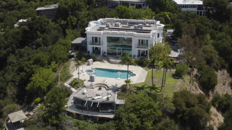 Aerial-of-Hollywood-Hills-mansion-with-large-swimming-pool-and-guest-quarters