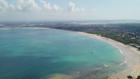 Bali-Indonesia-Beautiful-Jimbaran-Bay-Beach-with-Clear-Blue-Ocean-Aerial-Panning-Drone