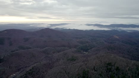aerial-fog-over-mountains-at-sunrise-near-sampson,-boone-and-blowing-rock-nc,-north-carolina