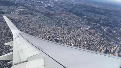 Airplane-wing-view-of-philadelphia-skyline