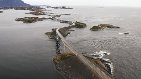 Beautiful-Aerial-Orbit-Of-Atlantic-Ocean-Road-And-Storeseisundet-Bridge,-Norway