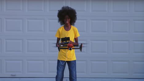 African-American-adolescents-with-huge-Afro-flying-drone