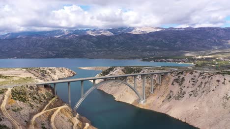 Aerial-View-On-The-Beautiful-Maslenica-Bridge-On-A-Cloudy-Day-In-Croatia---drone-shot