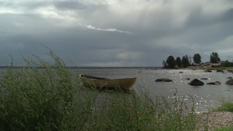 Moored-yellow-rowing-boat-in-Käsmu-Bay,-Baltic-Sea,-Estonia,-static-shot