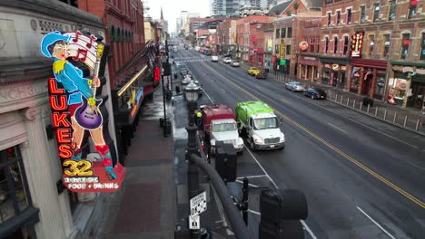 nashville-tennessee-bars,-honky-tonk-bars-on-broadway-and-lower-broadway-street-aerial