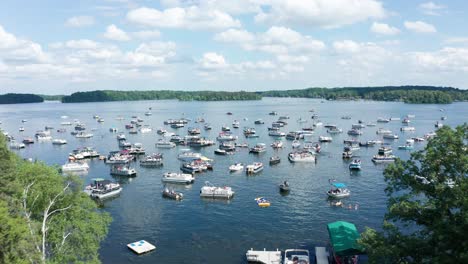 Aerial,-boats-crowded-on-a-lake-during-spring-summer-break