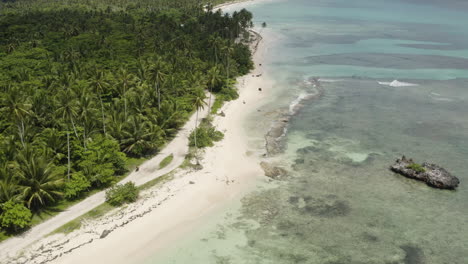 Aerial-pull-shot-over-miles-of-golden-sandy-beaches-in-Playa-Rincon-in-the-Dominican-Republic