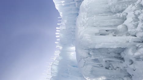 Ice-formations,-fountain-in-the-ice-castles,-winter-vacation,-vertical-video