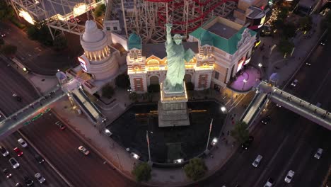 Aerial-Drone-shot-of-the-Statue-of-Liberty-on-the-Las-Vegas-Strip-during-Sunset