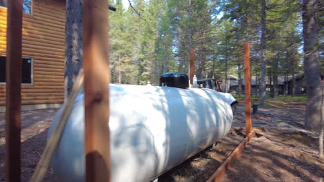 Large-propane-storage-for-an-outdoor-cabin-in-the-woods