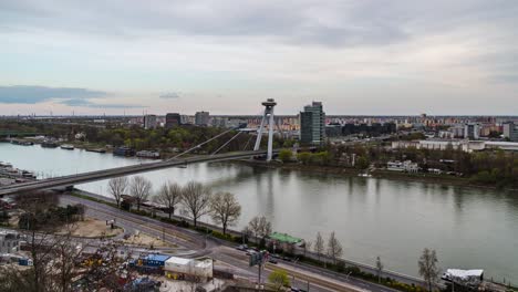 Timelapse-of-SNP-or-UFO-Bridge-in-Bratislava,-Slovakia,-blurry-traffic,-day-zoom-view