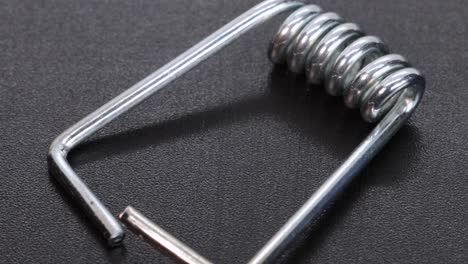 Steel-elastic-clothespin-spring,-macro-shot