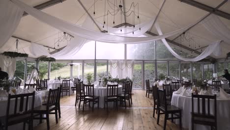 Wonderful-vintage-boho-wedding-hall-with-lots-of-green-plants-and-huge-windows