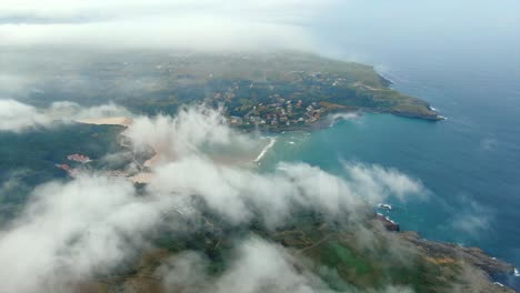 Cantabria-Coastline,-Scenic-Ajo-bay,-Aerial-view-above-clouds,-Spain