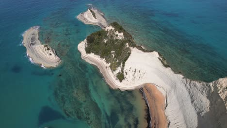 Panning-down-shot-of-white,-tall-cliffs-in-Corfu,-Greece