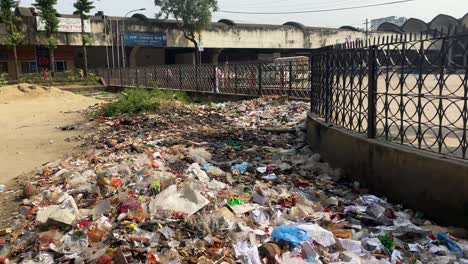 Camera-focuses-on-the-dump-yard-in-a-building-premises-where-a-huge-amount-of-plastic-and-other-polluting-wastes-are-dumped