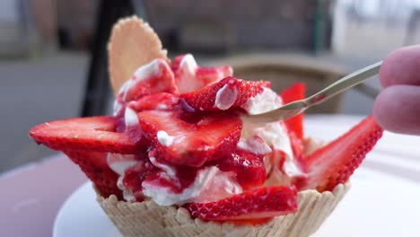 Eating-strawberry-ice-cream-close-up