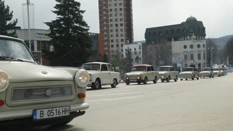 Convoy-of-Eastern-European-Trabant-retro-classic-cars-drive-through-city-streets-in-Veliko-tarnovo