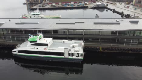 High-speed-passenger-express-boat-named-Fjordlys-from-Norled-company-is-alongside-dock-in-Stavanger-Norway---Aerial
