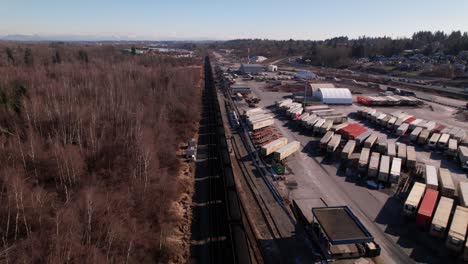 Cargo-train-running-on-railway-beside-Vancouver-shipping-terminal-in-Canada