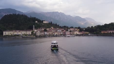 Passenger-Ferry-Boat-Traveling-to-Bellagio-Town-at-Lake-Como,-Italy,-Aerial
