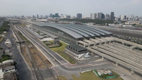Aerial-Pullback-from-Thailand's-new-railway-hub,-Bang-Sue-Grand-Station-in-Bangkok