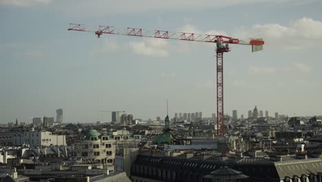 Tower-Crane-working-construction-repair-in-downtown-of-paris-city-action-shot-4k-60p