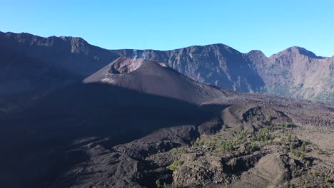 Closing-in-the-crater-cone-of-Mount-Rinjani-active-volcano-in-Indonesia,-Nusa-Tenggara,-Aerial-dolly-in-shot