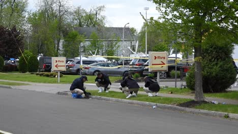 Officers-investigating-crime-scene-after-mass-shooting-in-Buffalo,-Tops-supermarket