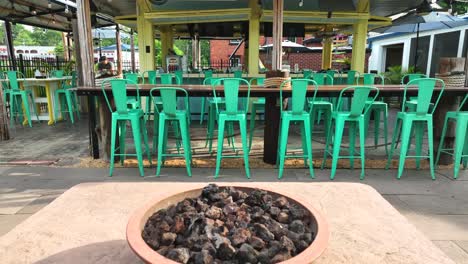 Fire-pit-and-retro-seating-at-outdoor-tiki-bar