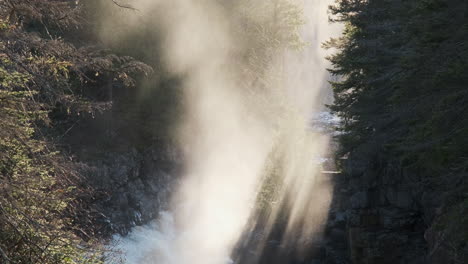 Magical-sunrays-through-the-morning-mist-of-a-rushing-river