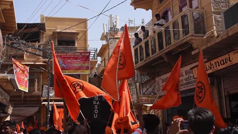 Indian-Hindu-people-wave-the-saffron-flag-in-the-parade-on-the-day-of-the-lord-Ram-also-called-Ram-Navami
