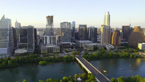 Aerial-view-of-modern-skyscrapers-in-sunlit-Austin,-USA---tracking,-drone-shot