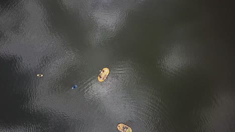 Overhead-view-of-a-yellow-rafting-boat-on-the-Nile-River-in-Jinja,-Uganda