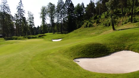 Golfer-preparing-to-play-on-field-of-Hills-golf-club-at-Molndal-near-Gothenburg,-Sweden