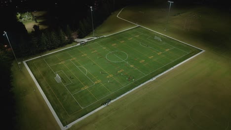 Aerial-view-of-football-league-at-night-from-above