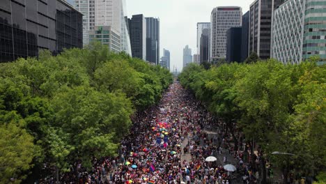 Rainbow-people-celebrating-equality-at-the-LGBTQ-Gay-Pride-Parade-in-Mexico-city---Aerial-view