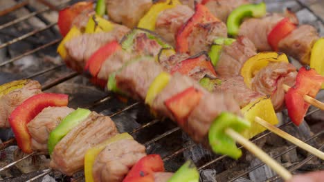 Hand-roasting-barbecue-beef-skewers-on-barbecue-grill