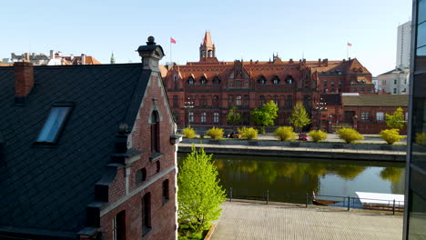 Main-Post-Office-building-in-Bydgoszcz-old-town---aerial-push-back-on-a-sunny-day