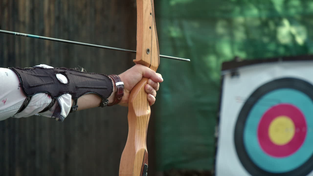 Premium Stock Video Firing A Archery Hunting Practice Bow On Target 9088