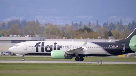 Flair-Airlines-Low-Cost-Carrier-Airplane-Rolling-Down-the-Runway-of-YVR