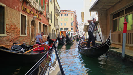 POV-Of-A-Person-Riding-Gondola-Exploring-The-Venice-City-Via-The-Canal-In-Italy