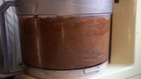 Close-Up-Of-Food-Processor-Blending-Raw-Ingredients-For-Baking-Cookies
